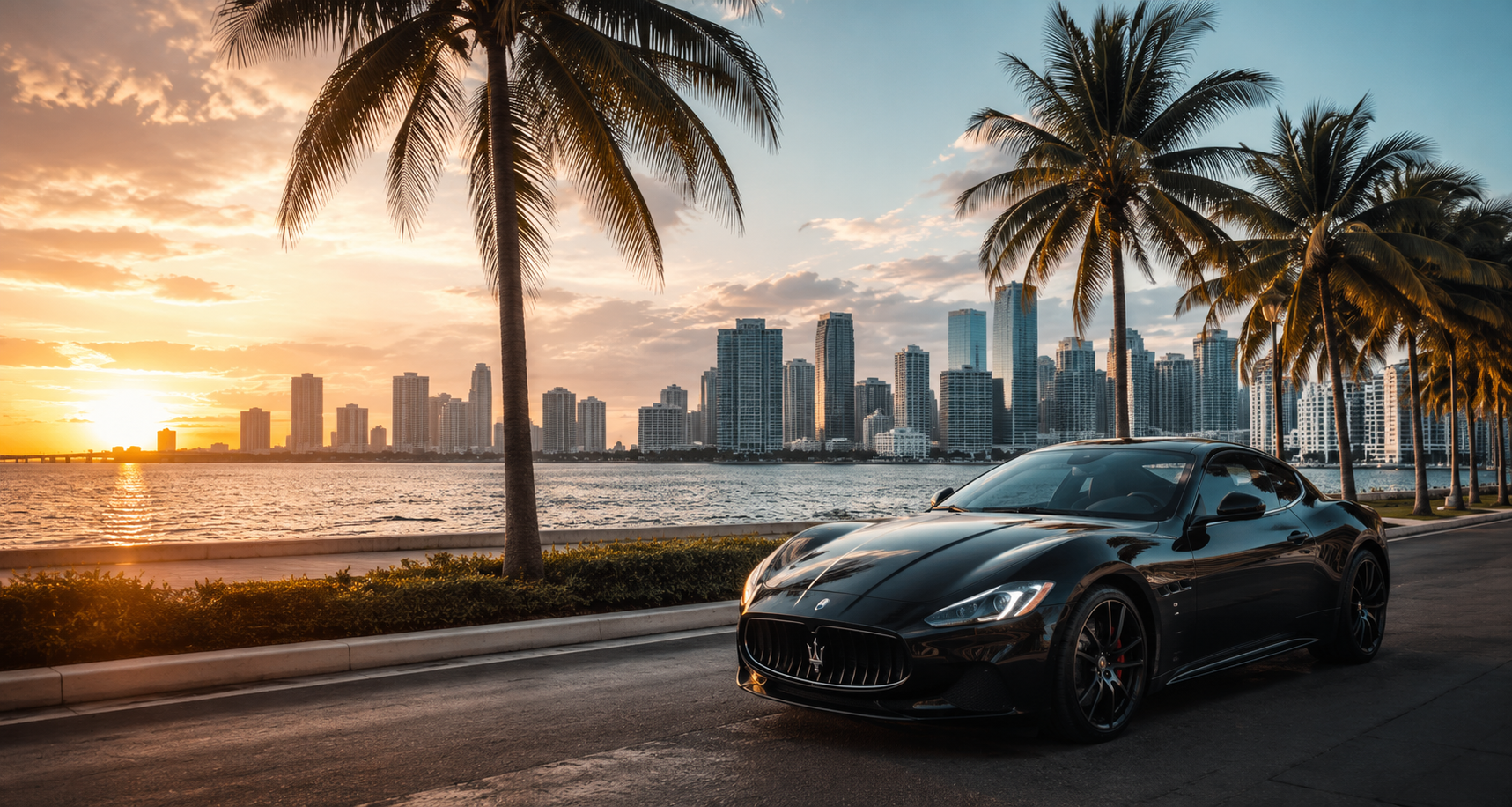 Luxury sports cars parked in front of the Miami skyline during sunset.
